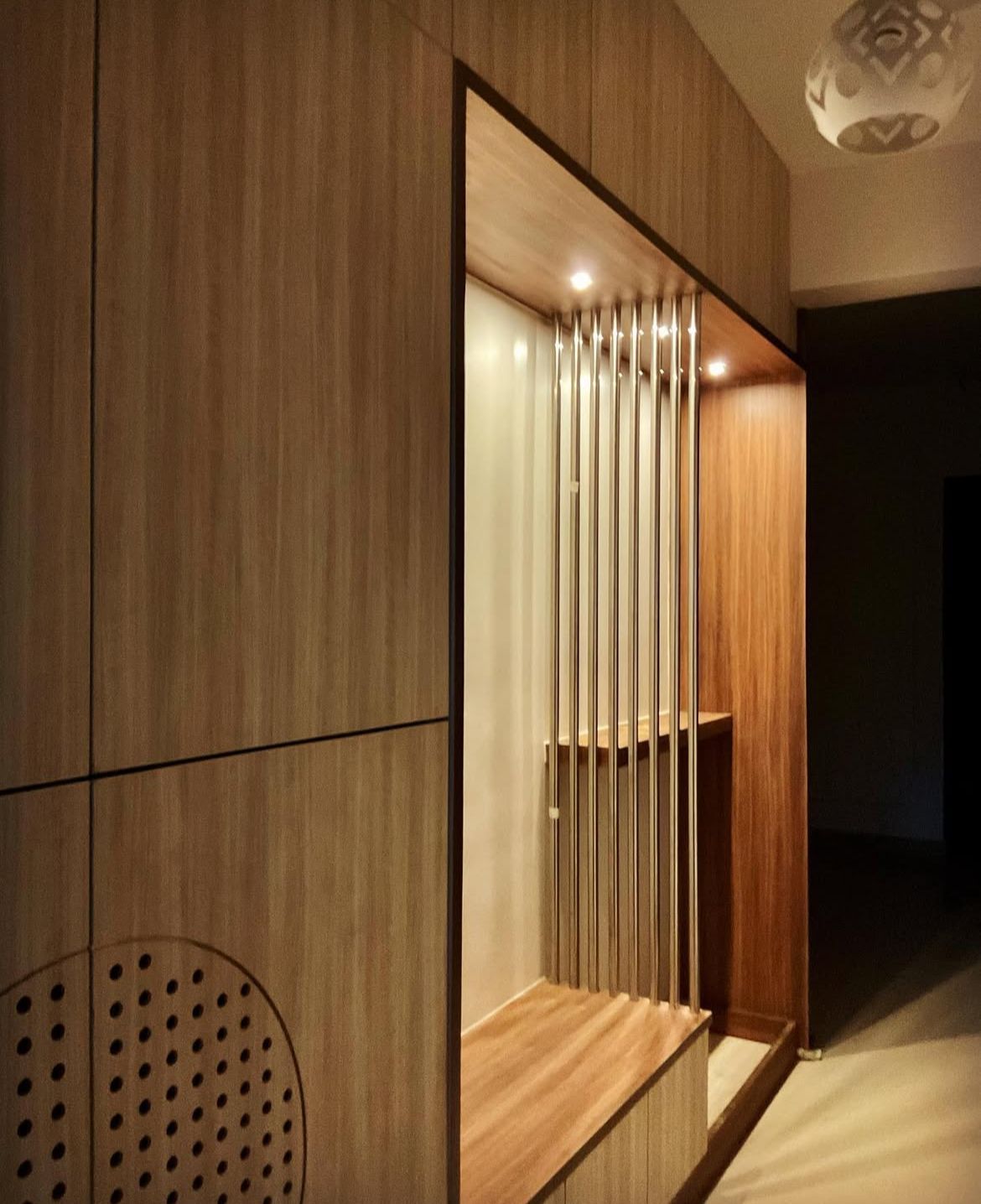 Wooden partition with vertical slats and ambient lighting